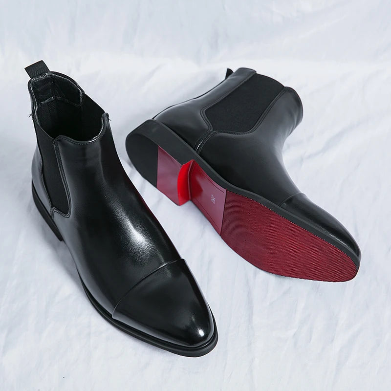 Elegant red men's slip-on Chelsea boots, featuring a distinctive cap toe. Fashionable ankle footwear for men.