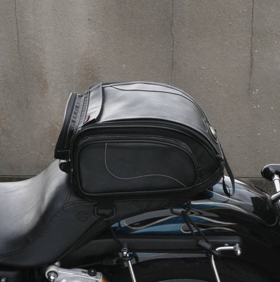 Unisex water-resistant motorcycle tail bag securely mounted on a bike, ready for travel and touring.