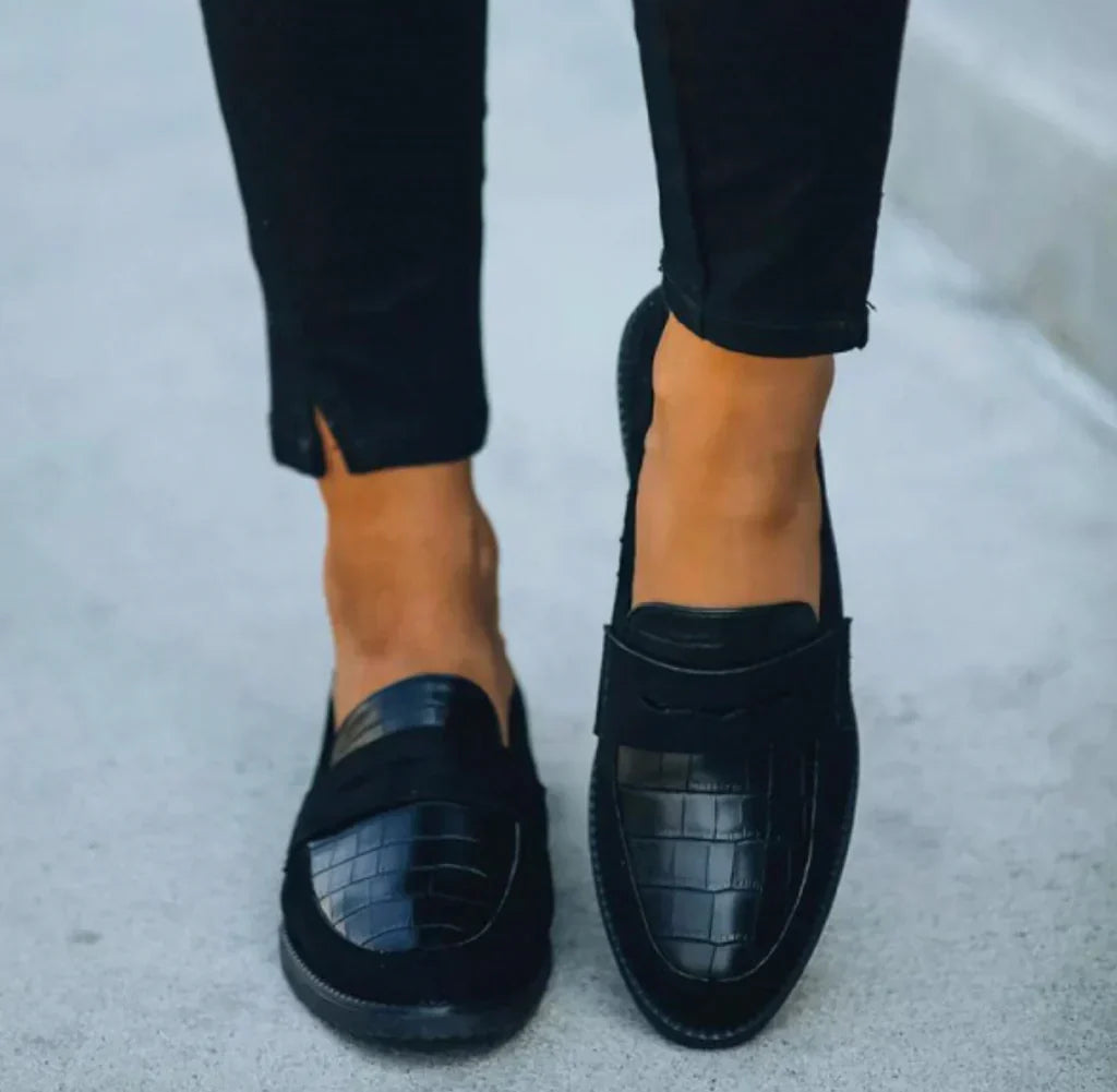 Comfortable & stylish women's slip-on loafers, featuring a chic croc print, perfect for versatile everyday wear.