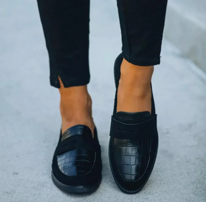 Comfortable & stylish women's slip-on loafers, featuring a chic croc print, perfect for versatile everyday wear.