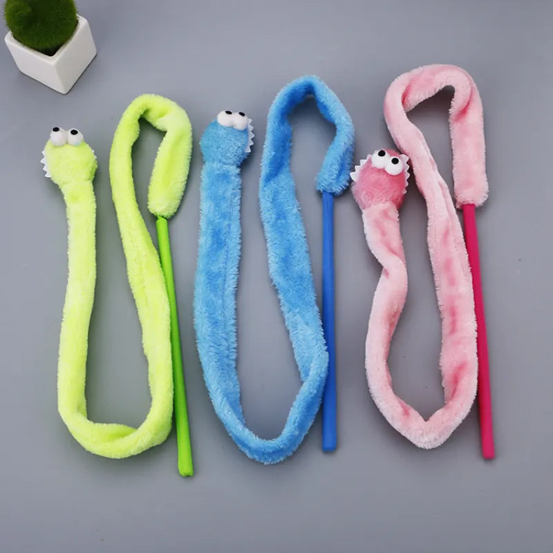 Blue plush interactive cat toy dangling worm for feline enrichment, stimulating hunting instincts & active play.