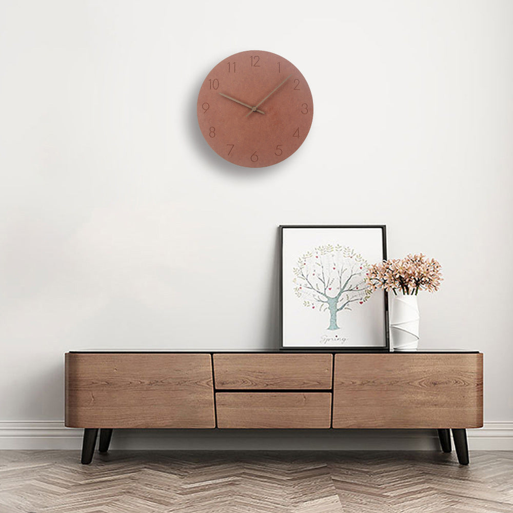 Round white Scandinavian silent wall clock, modern decor piece with minimalist wood accents.