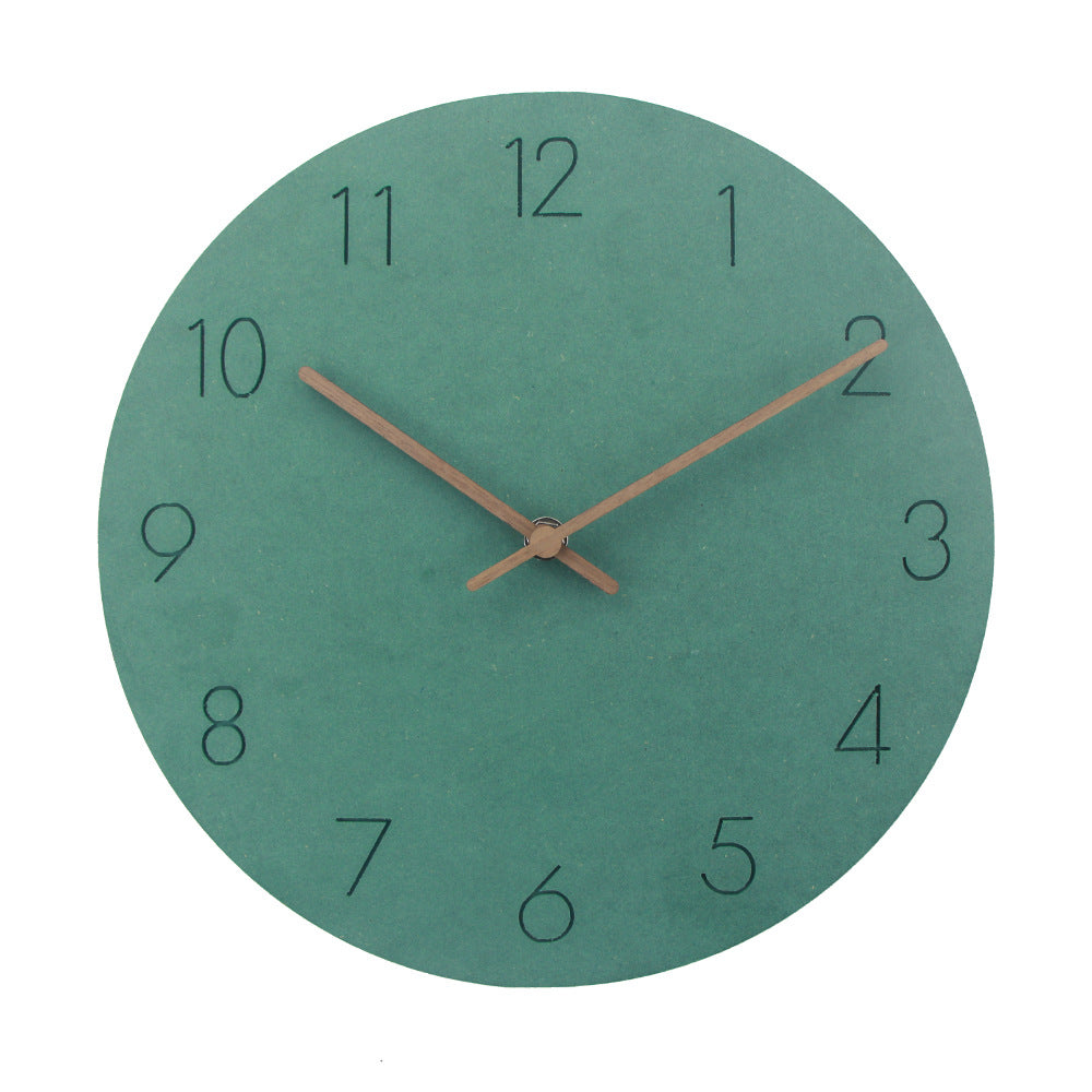 Black modern silent wall clock, round Scandinavian style wood for a refined home interior.