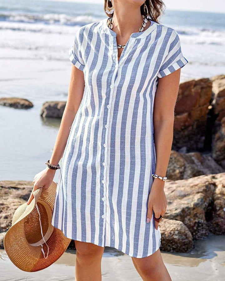 Blue striped women's shirt dress with a v-neck and relaxed fit, perfect for casual summer wear.
