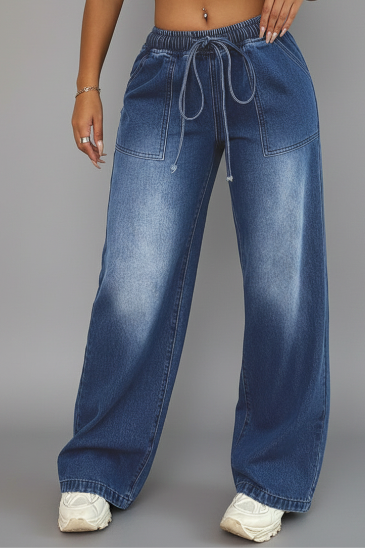 Comfortable women's blue wide-leg trousers featuring a functional drawstring waist, ideal casual apparel.