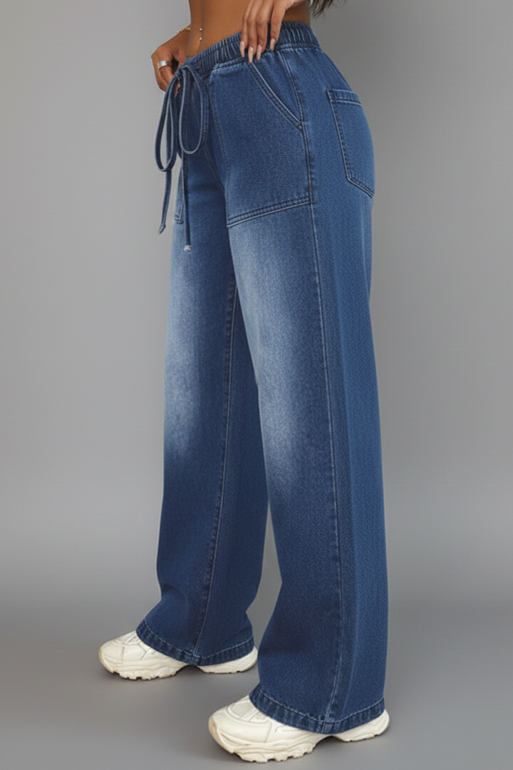 Relaxed fit blue wide-leg trousers for women, showcasing a practical drawstring waist and deep pockets.