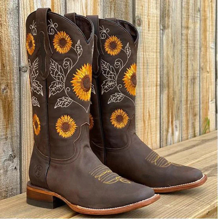 Vintage style women's leather boots with intricate bohemian embroidery, comfortable ankle height.