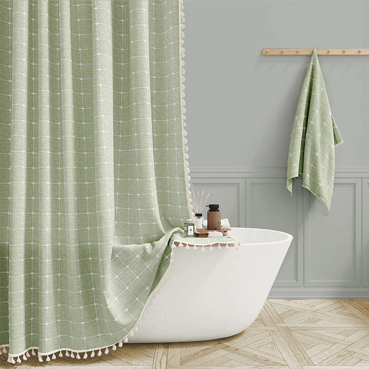 Elegant bohemian farmhouse shower curtain featuring decorative tassels, made from waterproof linen.