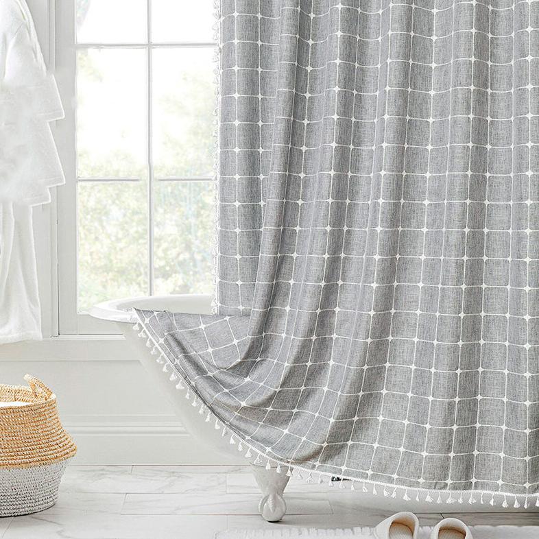 Neutral tone bohemian farmhouse waterproof linen shower curtain with tassels, great bathroom accent.