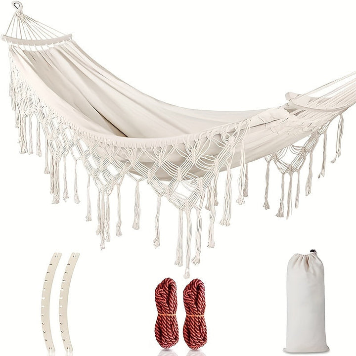 Bohemian Tassel Hammock for cozy outdoor relaxation. Striped cotton double hammock, perfect garden furniture.