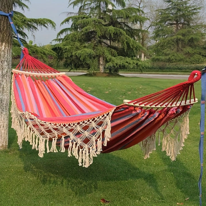 Close-up of the stylish tassels & striped pattern on the comfortable cotton bohemian hammock.