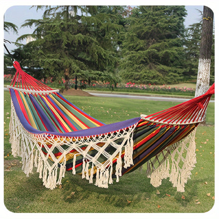 Detailed view of the bohemian tassel hammock's intricate striped design & soft cotton material.