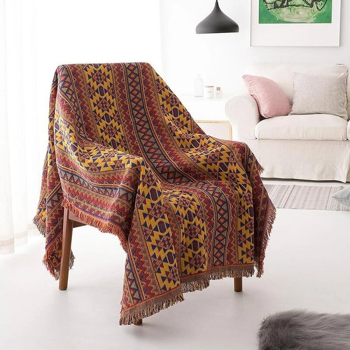 Tasseled bohemian accent blanket, a cozy addition to any room's decor.