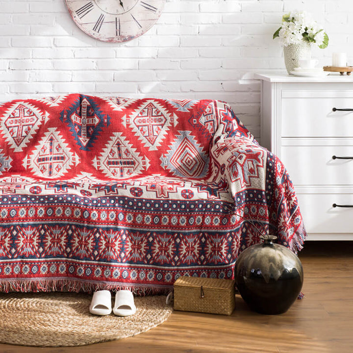 Knitted bohemian sofa throw with fringe, for stylish home decor.