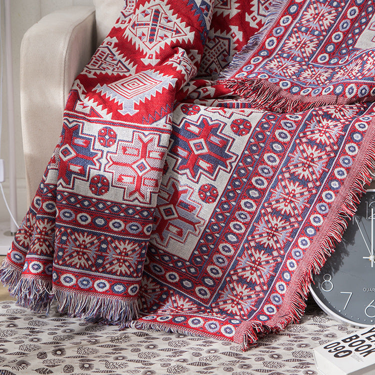 Bohemian sofa throw blanket, fringed and knitted, for stylish decor.