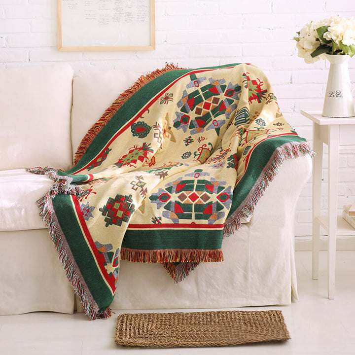 Soft bohemian accent throw, reversible knit with delicate tassels.