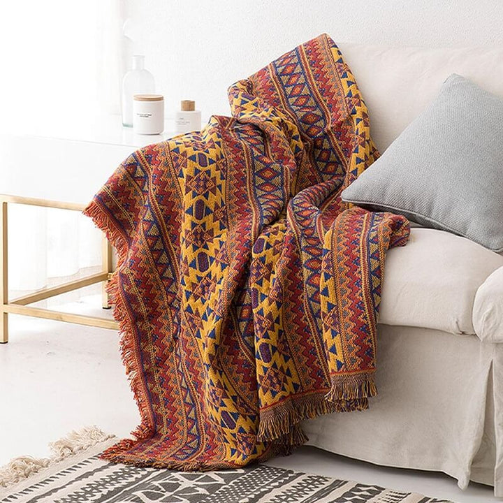 Reversible bohemian knitted sofa throw, versatile for home decoration.