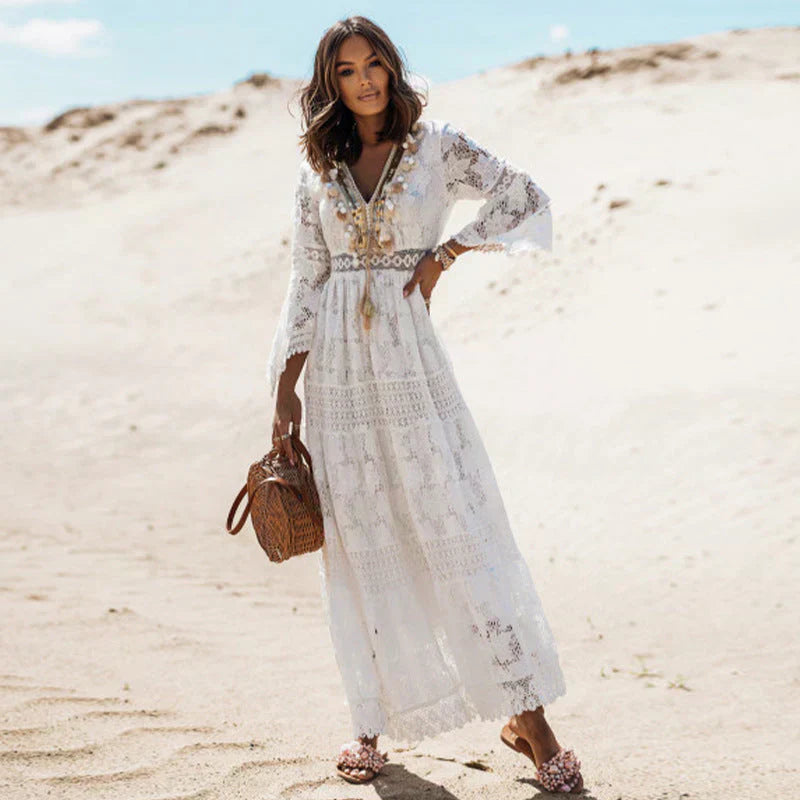 Flowy long sleeve bohemian maxi dress for women, perfect as a stylish summer beach dress.
