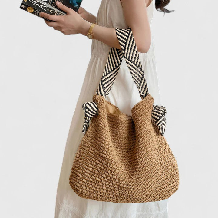 Bohemian woven shoulder bag with intricate patterns, perfect for summer casual wear.
