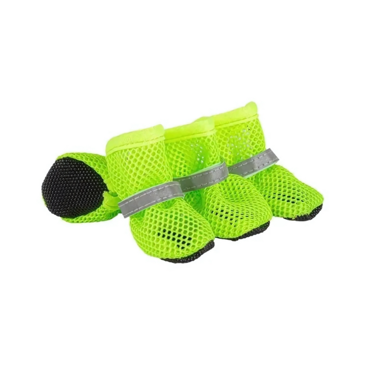 Reflective dog boots with breathable mesh for enhanced visibility and paw protection during all-terrain night walks.