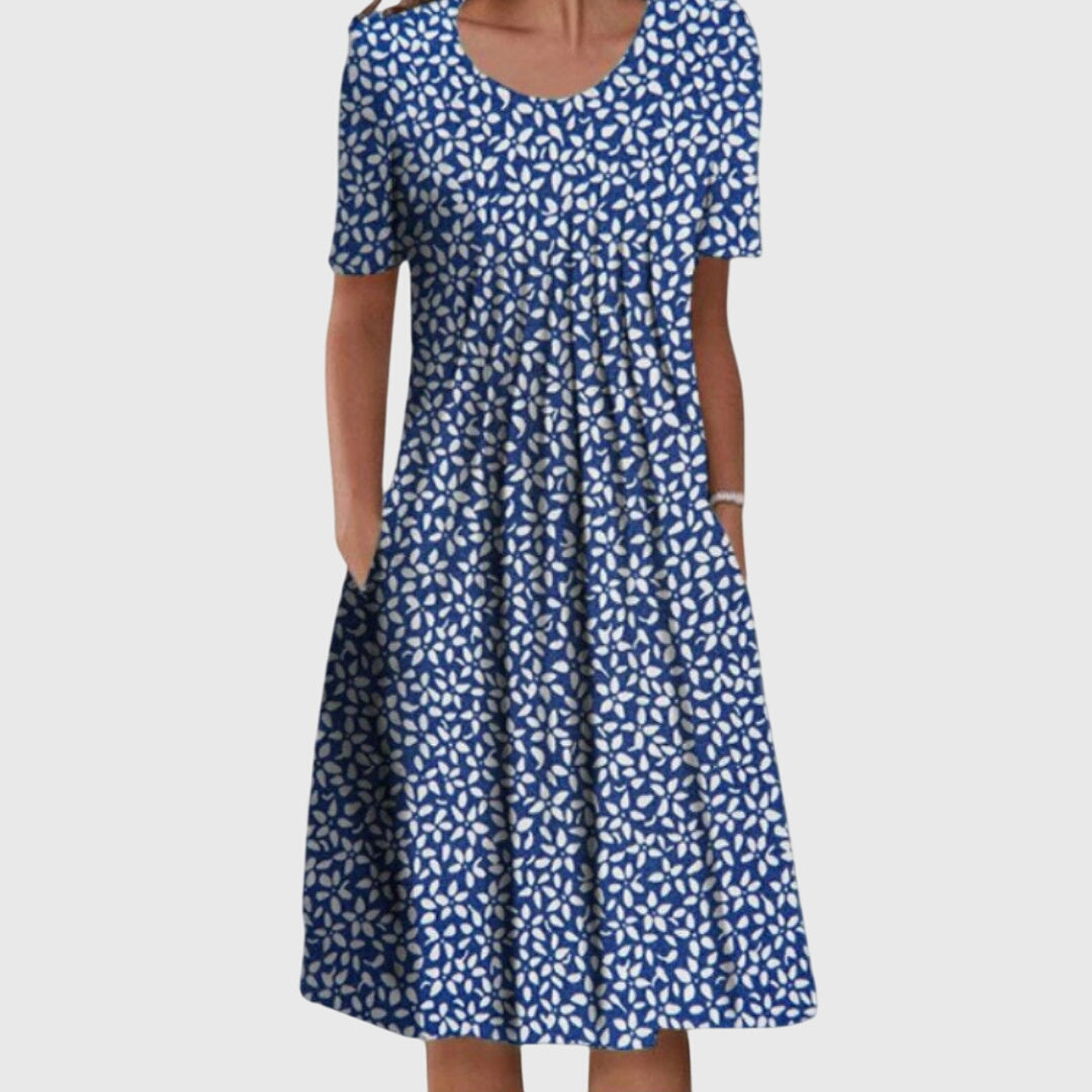 Versatile blue floral women's dress with a round neck, ideal for spring fashion and comfortable daily wear.
