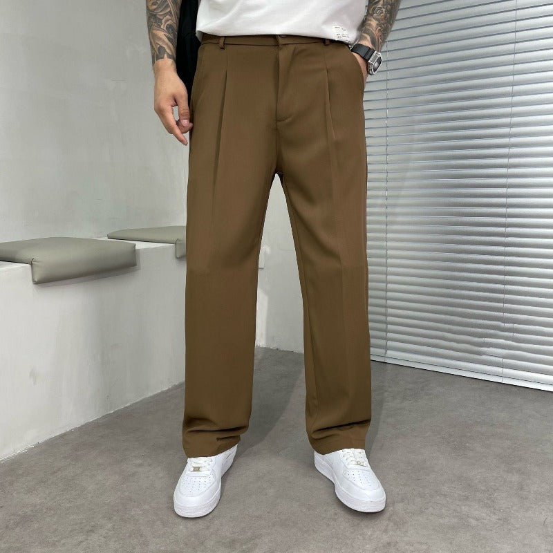 Modern men's wide-leg pleated dress pants styled for a smart casual look, perfect for professional settings.