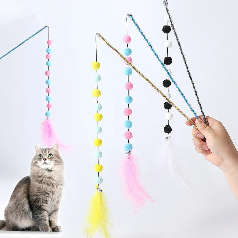 Close-up of the stimulating feather & soft pom pom interactive cat toy on a rod.