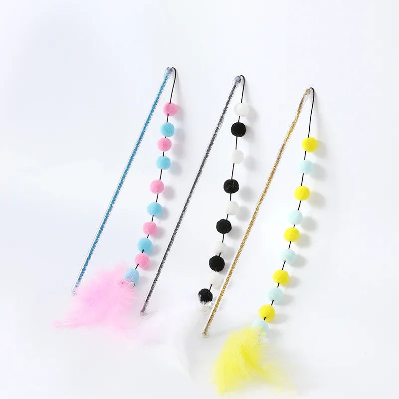 Adult cat actively playing with the stimulating feather & pom pom interactive play rod toy.