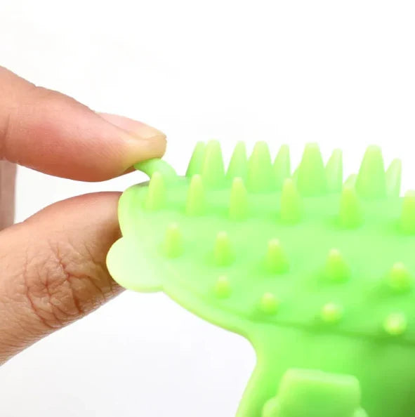 Multi-purpose silicone cat brush for itch relief, grooming, and stimulating gentle scratching.