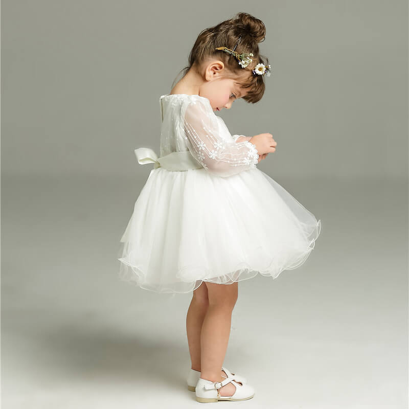 Elegant Clara girls' white polka dot tulle dress, perfect for ceremonies & festive special occasions.