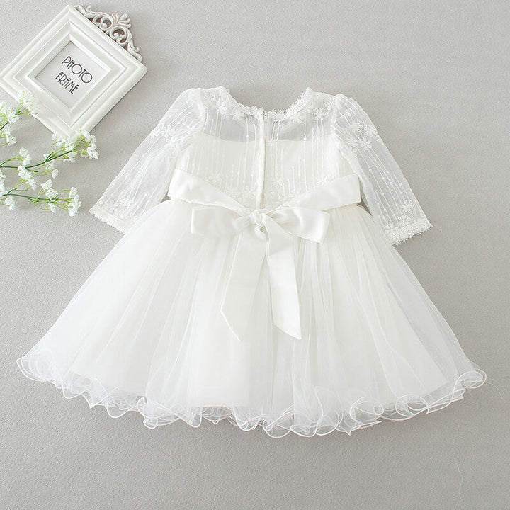 Festive Clara girls' polka dot tulle dress. A charming and elegant special occasion party wear for children.