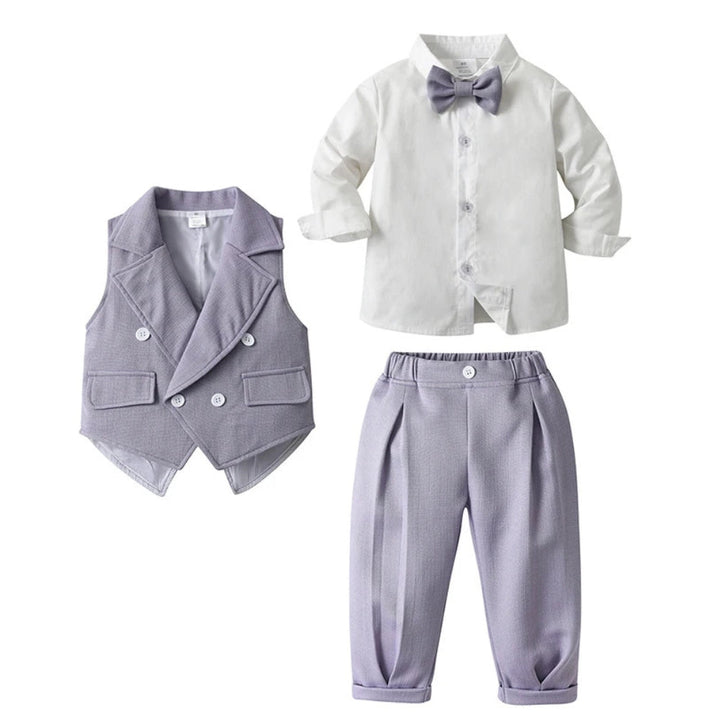 Boys' formal fashion: blue 3-piece suit with shirt, waistcoat, trousers & bow tie.