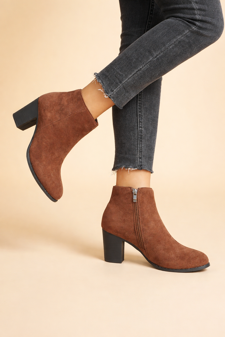 Chic brown women's ankle boots with block heel & side zip. Comfortable everyday footwear for fall and winter style.