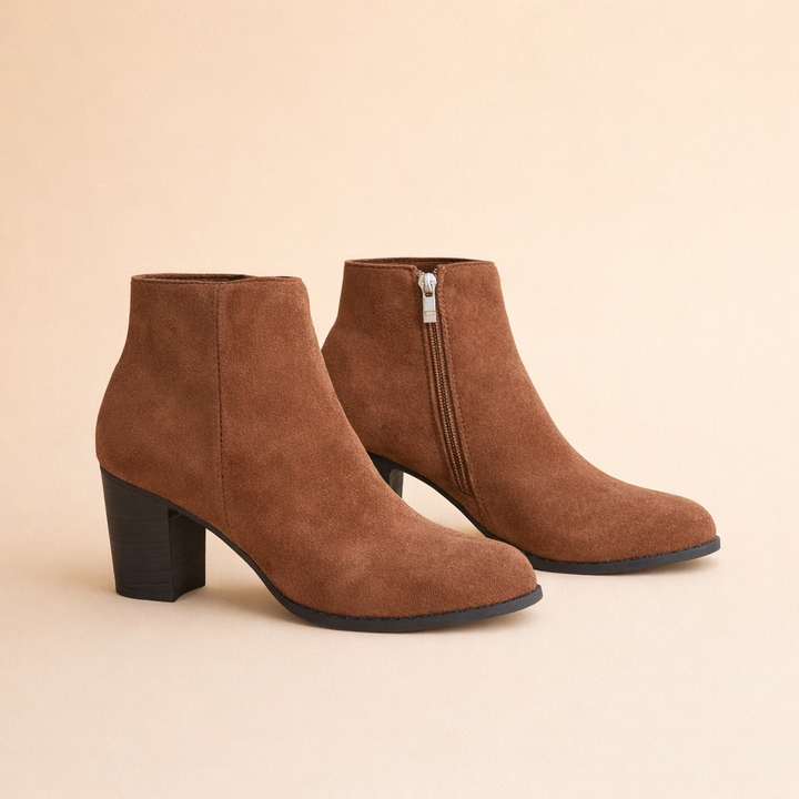Versatile women's brown ankle boots, comfortable block heel. Perfect for casual or formal fall/winter outfits.