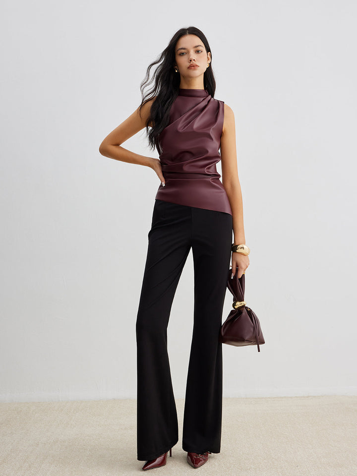Close-up of a women's high neck sleeveless top, showcasing the chic fabric texture.