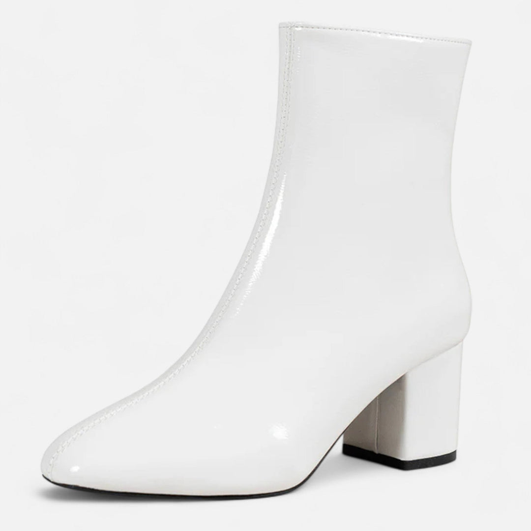 Chic women's black block heel ankle boots, perfect for everyday style and comfort. Stylish fall & winter footwear.