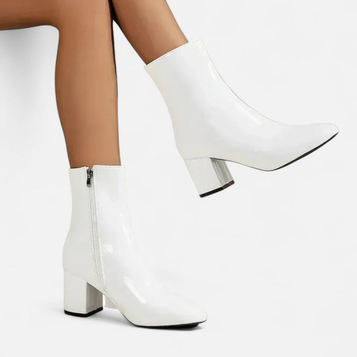 Detail shot of women's block heel ankle boots, highlighting the stylish design and comfortable fit for everyday wear.