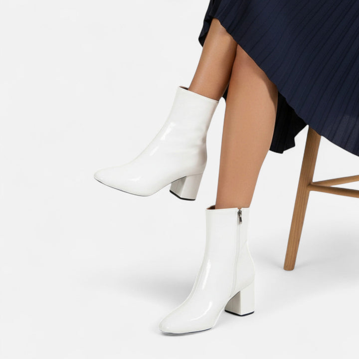 Stylish women's ankle boots with a block heel, offering comfort and chic fashion for all your fall and winter looks.