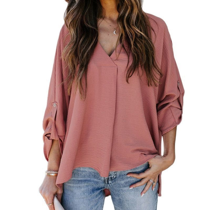 Soft women's V-neck blouse with a relaxed fit, ideal for comfortable summer and spring casual wear. Chic and versatile.