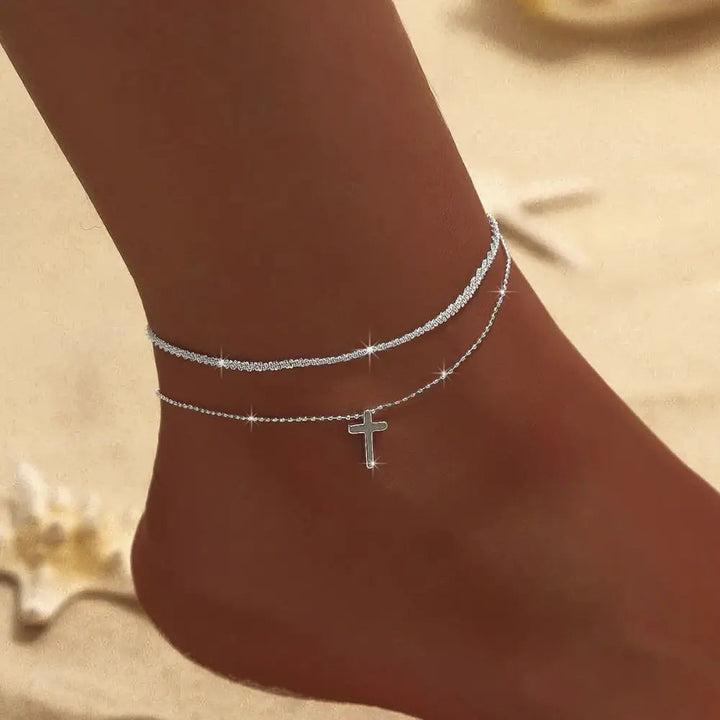Delicate women's silver & gold double ankle bracelet. Chic and elegant foot jewelry, perfect for any outfit.