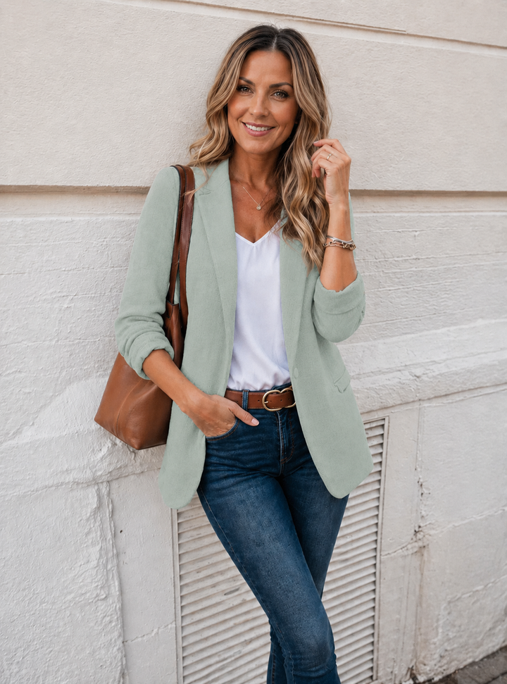 Chic women's elegant modern jacket. Tailored versatile outerwear for a sophisticated look, ideal for business casual fashion.