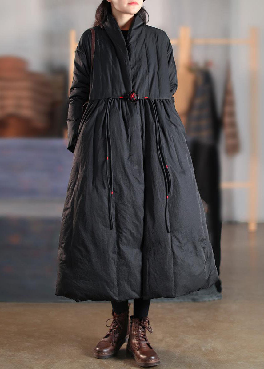 Chic women's high collar button winter coat in black. Warm, long-length outerwear for fall/winter fashion.
