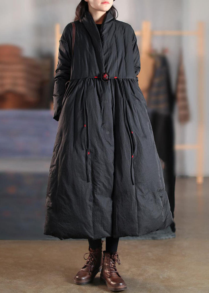 Chic women's high collar button winter coat in black. Warm, long-length outerwear for fall/winter fashion.