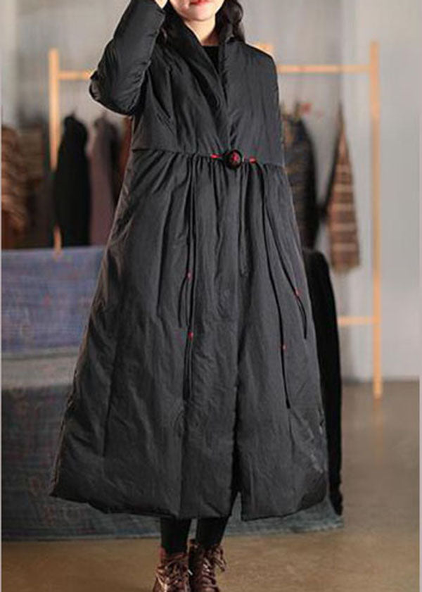 Elegant women's black loose fit winter coat with high collar & button front. Perfect warm everyday outerwear.
