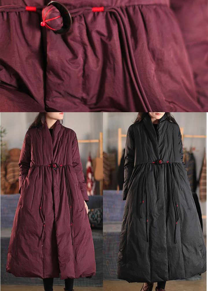 Women's chic black button winter coat with a high collar & long length. Warm, loose fit outerwear for everyday style.