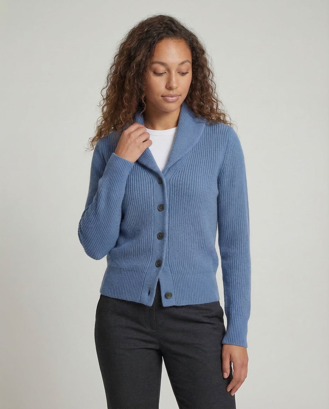Comfortable women's button-front cardigan with a stylish lapel collar. Perfect long sleeve knitwear.