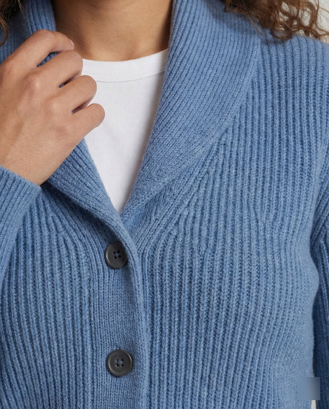 Stylish women's lapel collar cardigan. Elegant button-front, long sleeve knit ideal for office fashion.