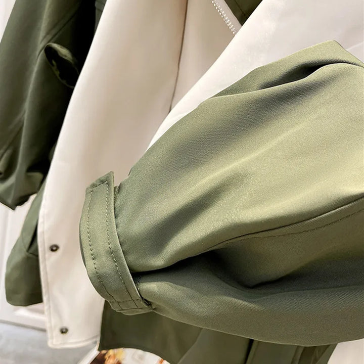 Full shot of a women's waterproof hooded windbreaker, demonstrating its sleek and modern look