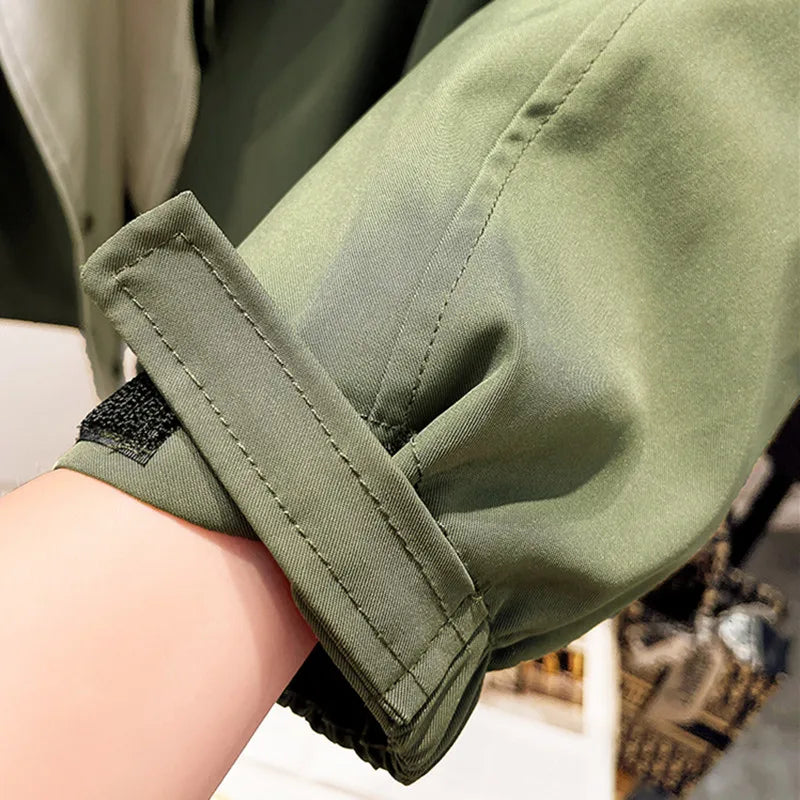 Women's windbreaker jacket with adjustable hood and cuffs for comfortable, customized fit