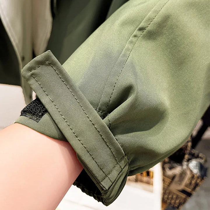 Women's windbreaker jacket with adjustable hood and cuffs for comfortable, customized fit